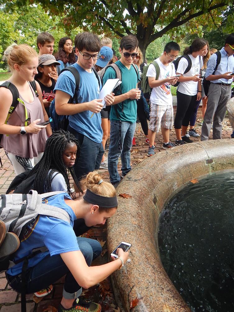 Once & Future planet community researching stone while on a campus field trip