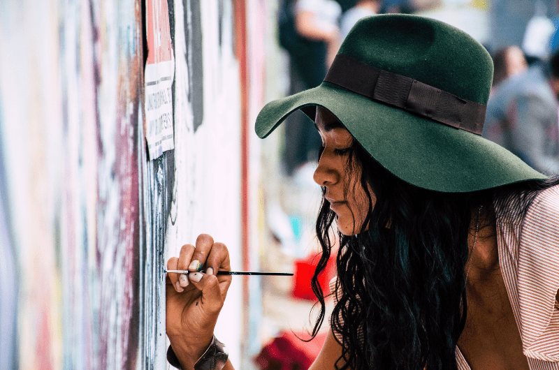 artist paints wall