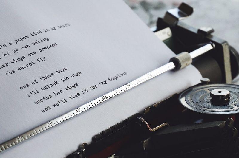 typewriter with words on page