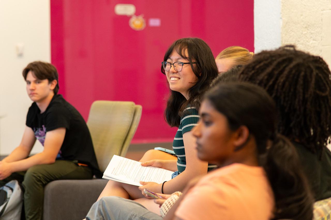 student in group smiling